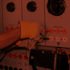 An electrician using a multimeter